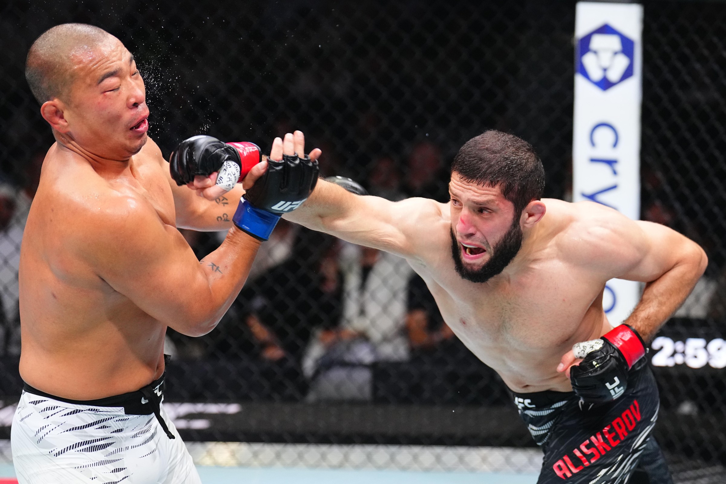 ABU DHABI, UNITED ARAB EMIRATES - OCTOBER 25: (R-L) Ikram Aliskerov of Russia punches JunYong Park of South Korea in a middleweight fight during the UFC 321 event at Etihad Arena on October 25, 2025 in Abu Dhabi, United Arab Emirates. (Photo by Chris Unger/Zuffa LLC)
