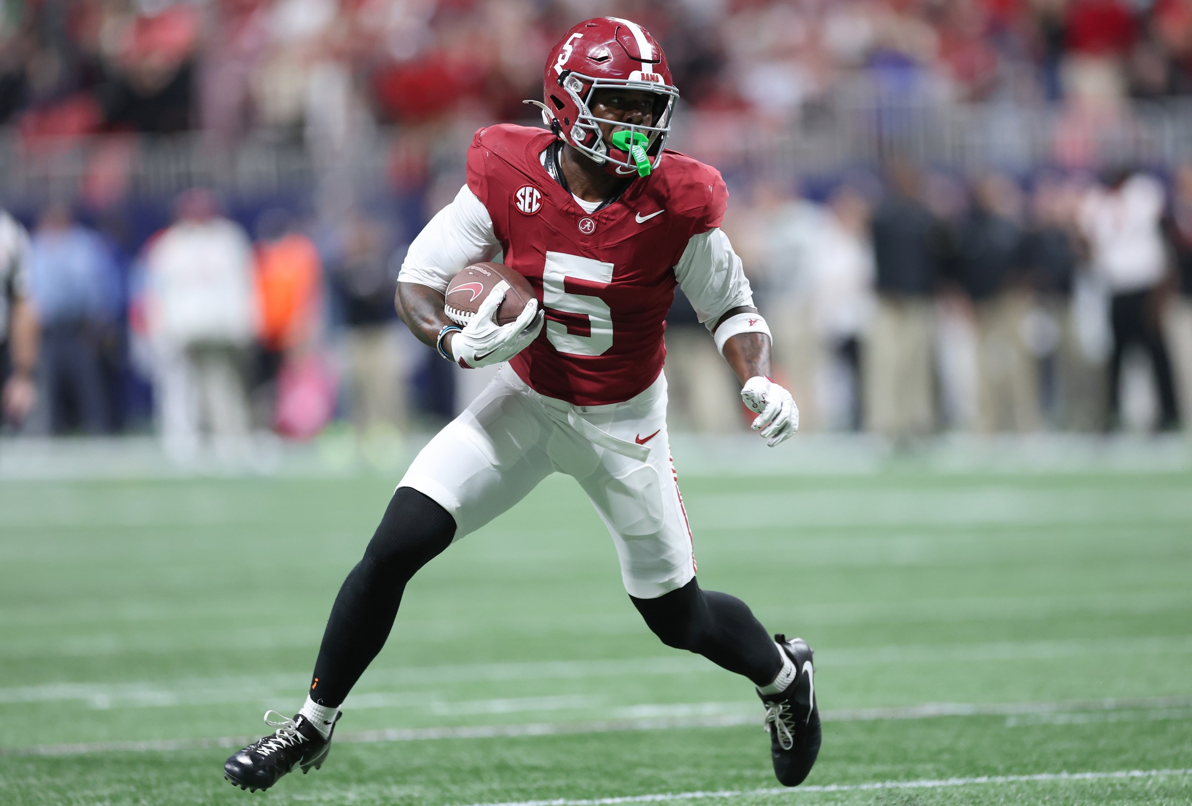 ATLANTA, GEORGIA - DECEMBER 06: Germie Bernard #5 of the Alabama Crimson Tide catches a pass and runs the ball for a touchdown against the Georgia Bulldogs during the fourth quarter in the 2025 SEC Championship at Mercedes-Benz Stadium on December 06, 2025 in Atlanta, Georgia. (Photo by Kevin C. Cox/Getty Images)