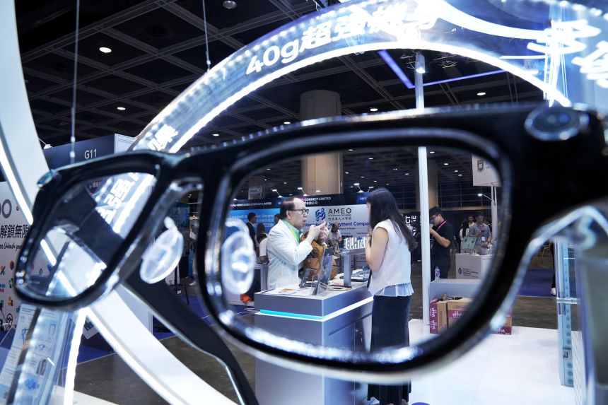 Visitors view AI solutions at the iFLYTEK booth during the the