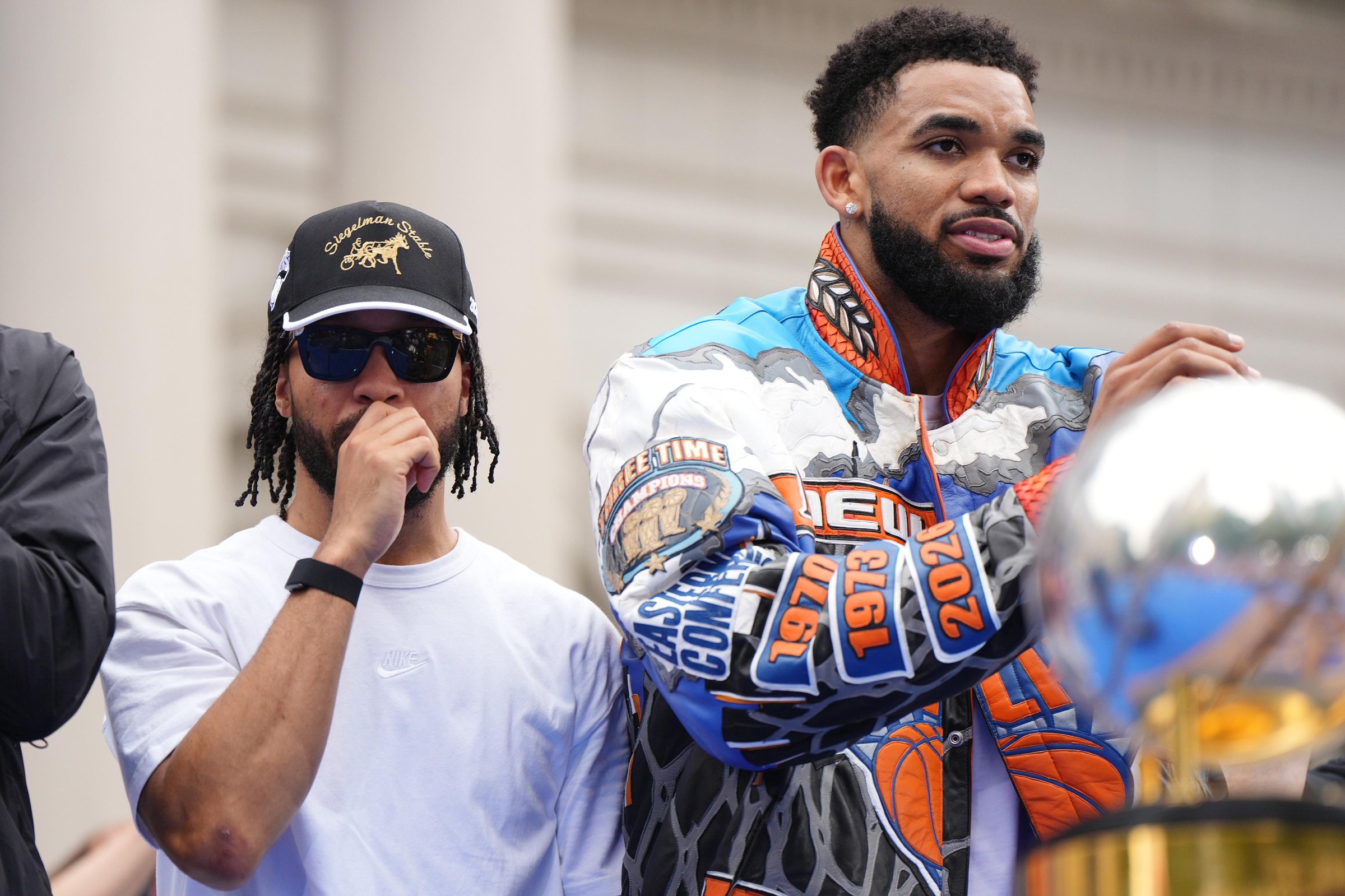 NEW YORK, NEW YORK - JUNE 18: Karl-Anthony Towns #32 and Jalen Brunson #11 look on during the New York Knicks Championship ticker tape parade and victory rally celebrating winning the 2026 NBA Finals on June 18, 2026 in New York City. The New York Knicks defeated the San Antonio Spurs in five games to win their first NBA Championship in 53 years. (Photo by Angelina Katsanis/Getty Images)