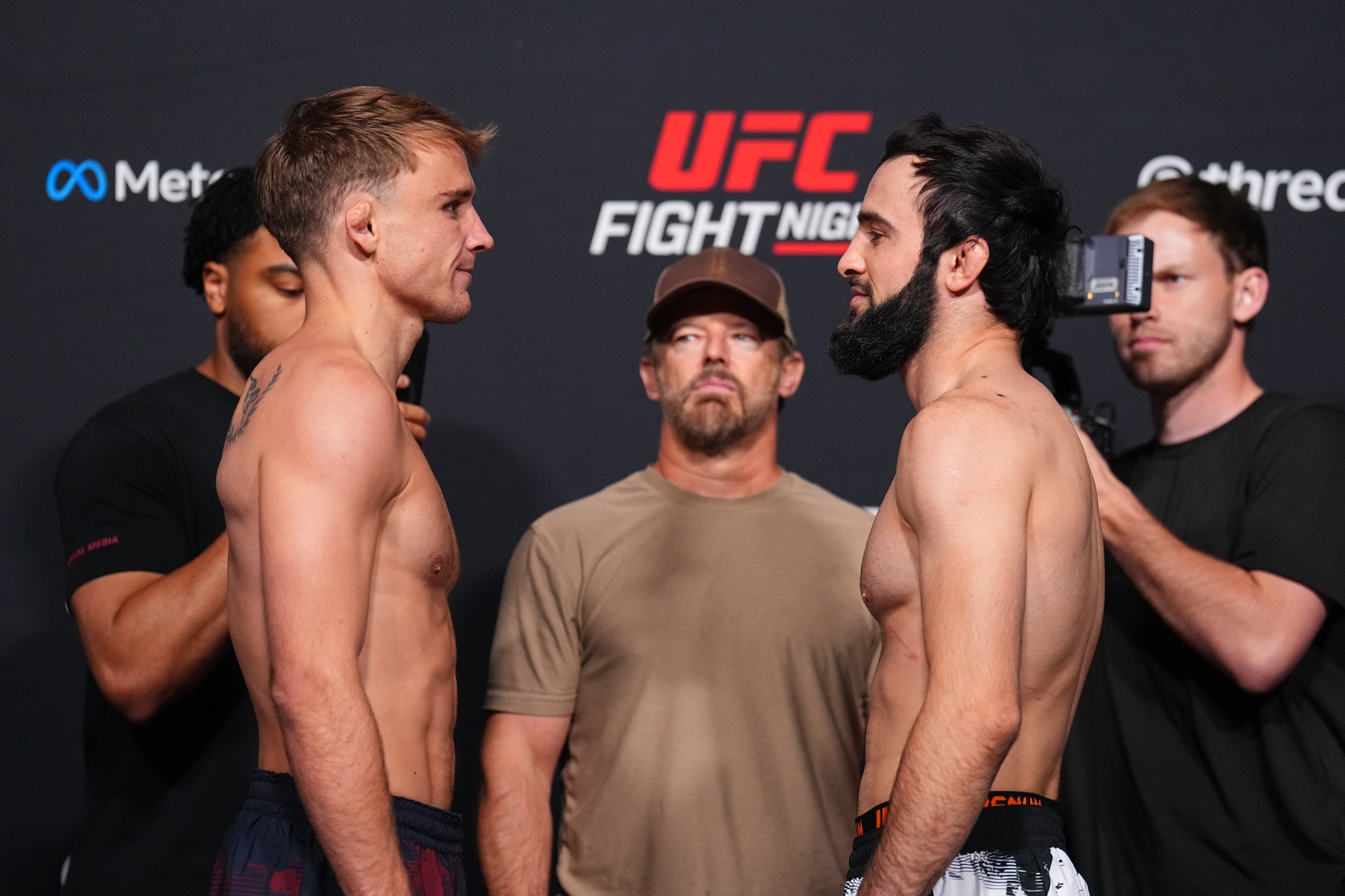 LAS VEGAS, NEVADA - JUNE 19: (L-R) Shane Collins and Otari Tanzilovi of Georgia face off during the UFC Fight Night official weigh-ins at Meta APEX on June 19, 2026 in Las Vegas, Nevada. (Photo by Chris Unger/Zuffa LLC)