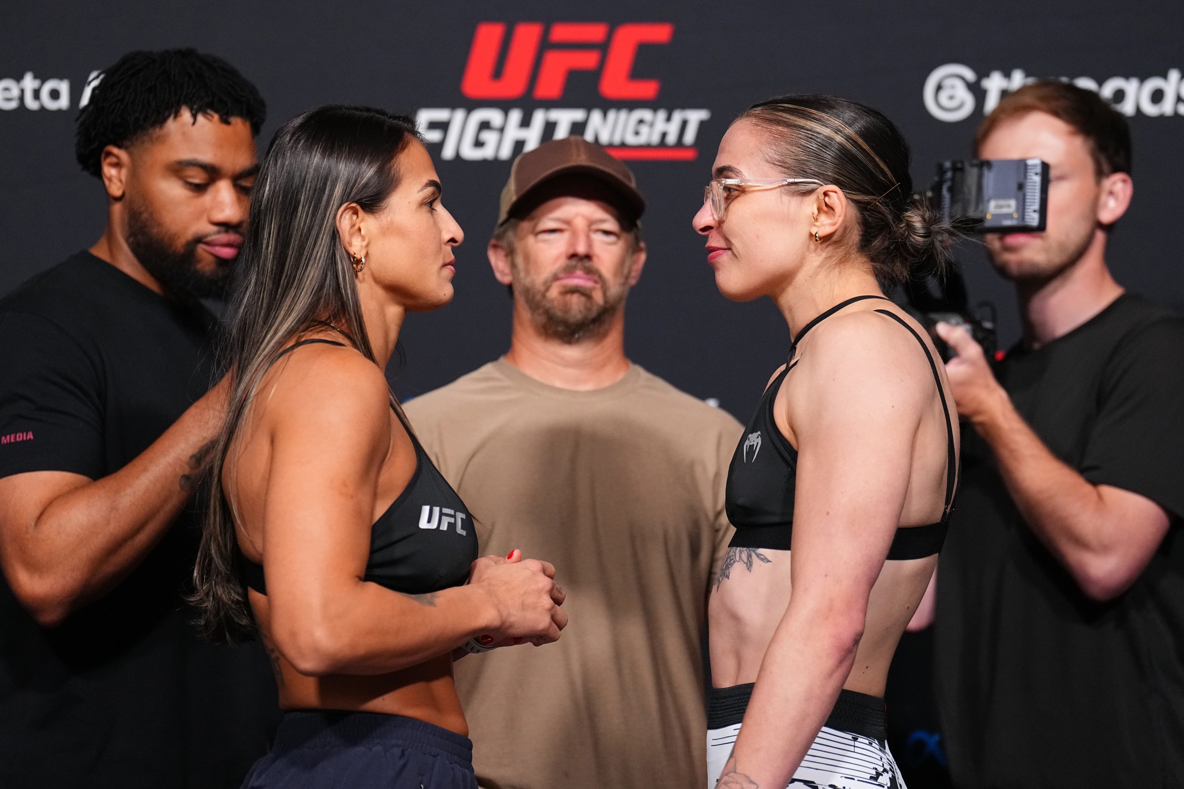 LAS VEGAS, NEVADA - JUNE 19: (L-R) Bia Mesquita of Brazil and Melissa Mullins of England face off during the UFC Fight Night official weigh-ins at Meta APEX on June 19, 2026 in Las Vegas, Nevada. (Photo by Chris Unger/Zuffa LLC)
