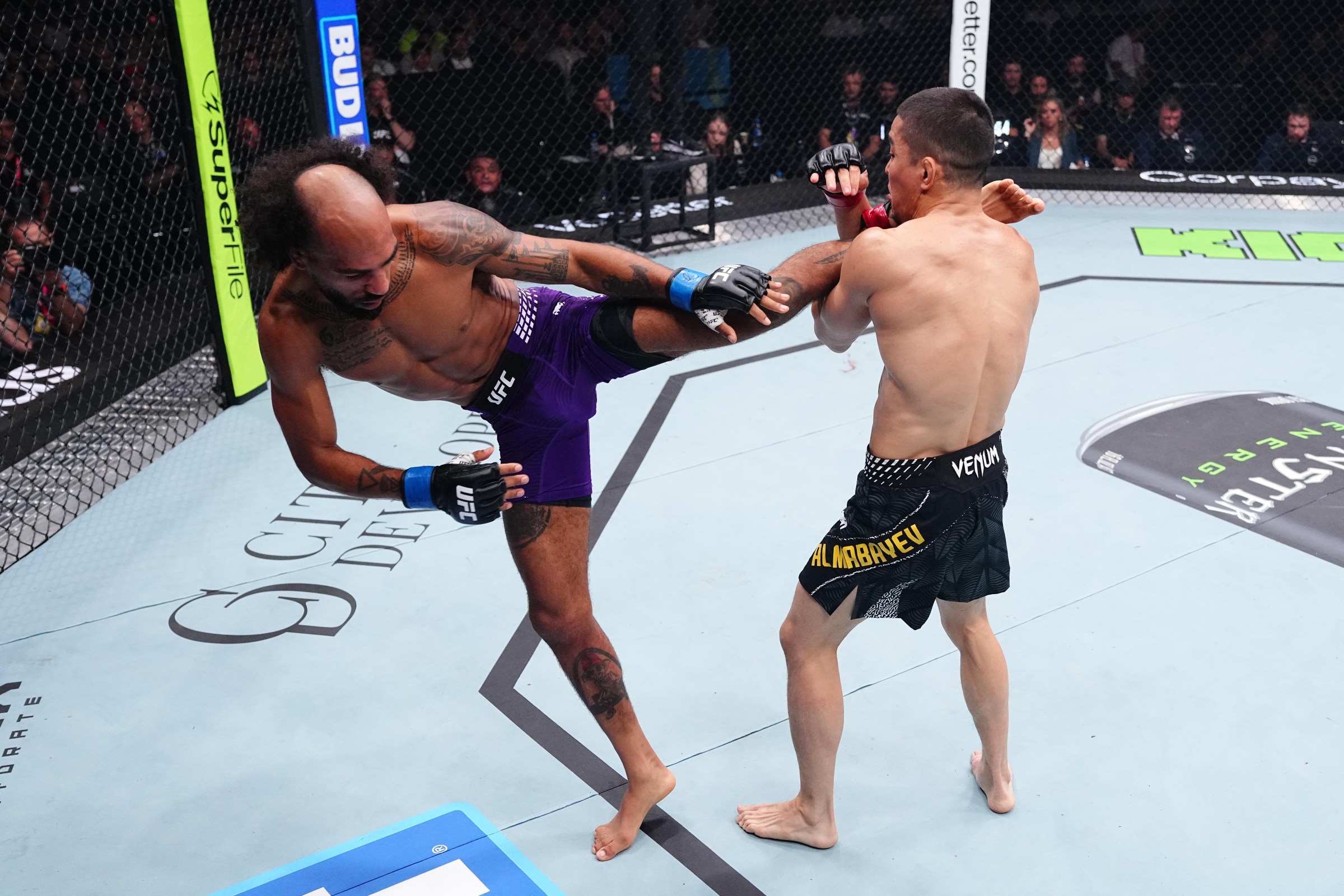 BAKU, AZERBAIJAN - JUNE 27: (L-R) Charles Johnson kicks Asu Almabayev of Kazakstan in a flyweight fight during the UFC Fight Night event at National Gymnastics Arena on June 27, 2026 in Baku, Azerbaijan. (Photo by Jeff Bottari/Zuffa LLC)