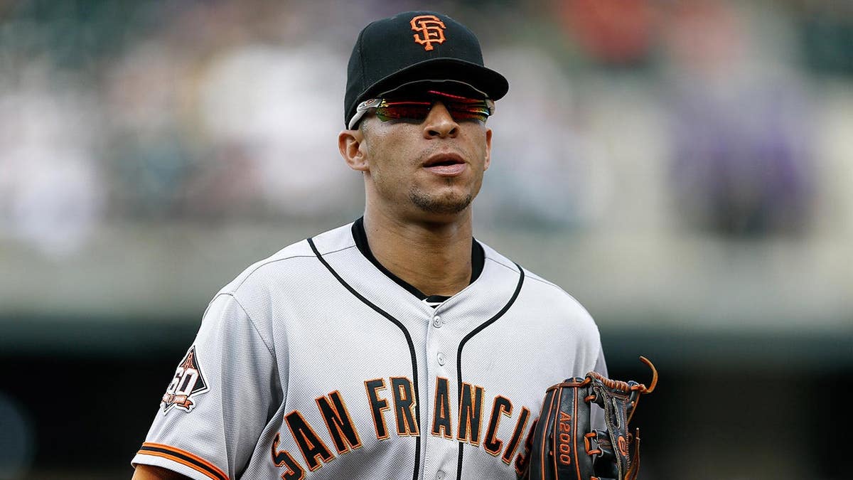San Francisco Giants center fielder Gorkys Hernandez running to the dugout at Coors Field.