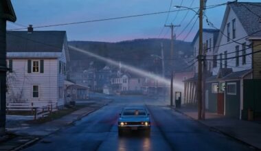 A blue car drives down a deserted street lined with houses at dusk; the sky is fading blue, power lines crisscross overhead, and distant hills and mist create a moody, quiet atmosphere.