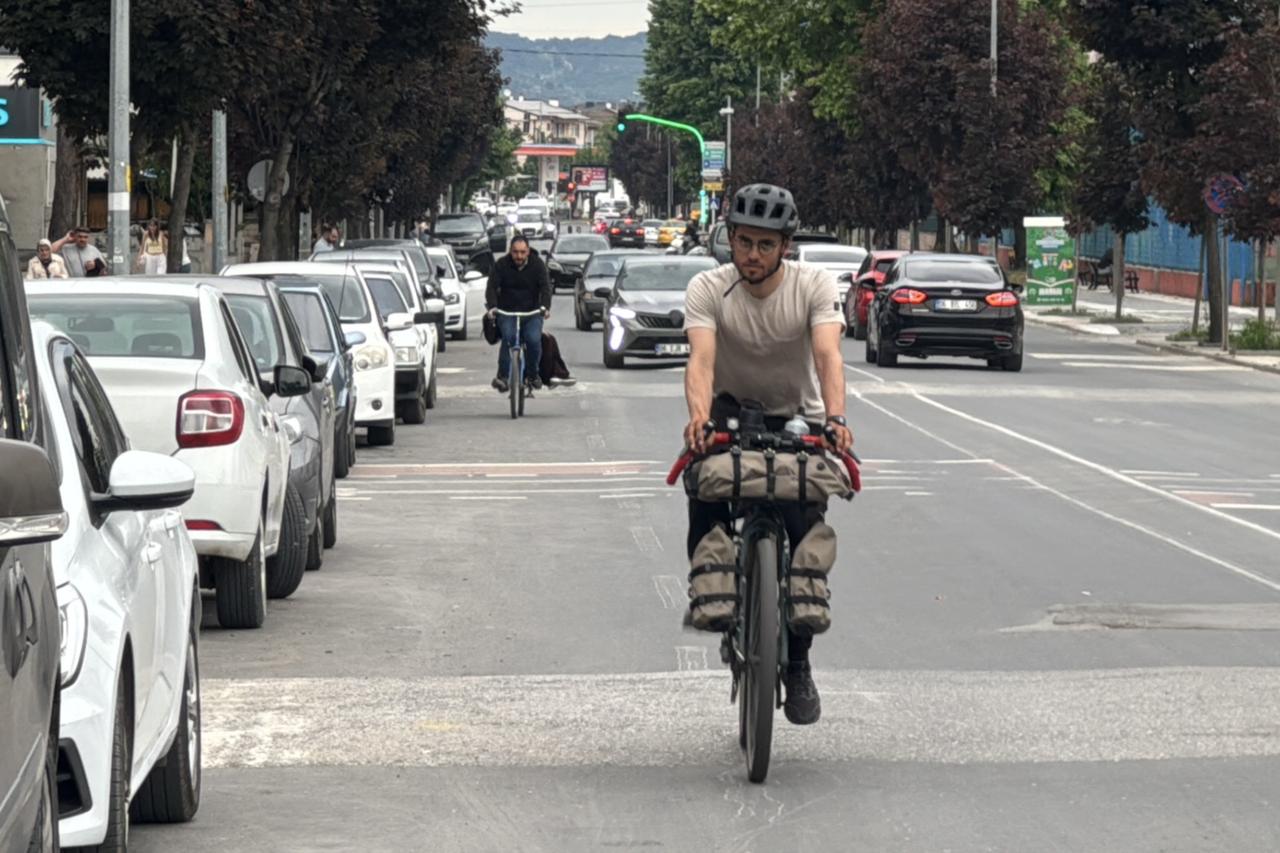 Italian traveler Federico Pagano cycles through Duzce during his long-distance bicycle journey from Milan to Tokyo, Türkiye, May 31, 2026. (AA Photo)