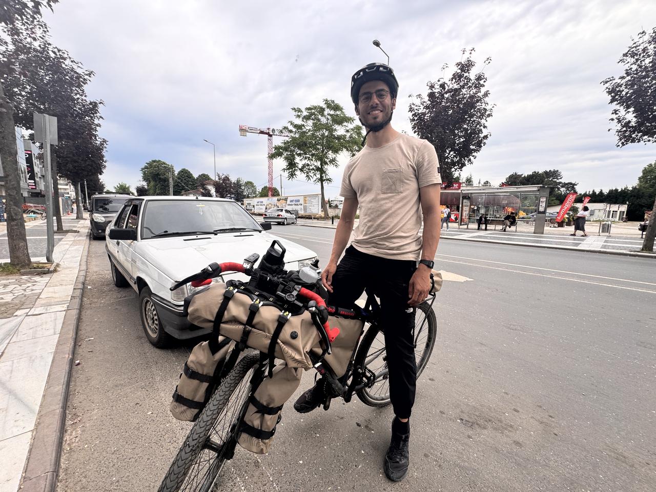 Italian cyclist Federico Pagano, who set off from Milan for Tokyo by bicycle, poses with his loaded bike after reaching Duzce, Türkiye, May 31, 2026. (AA Photo)