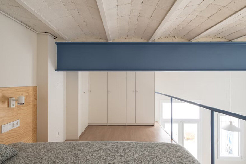NOT A STUDIO uses color-coded structure to open up century-old barcelona apartment - 14