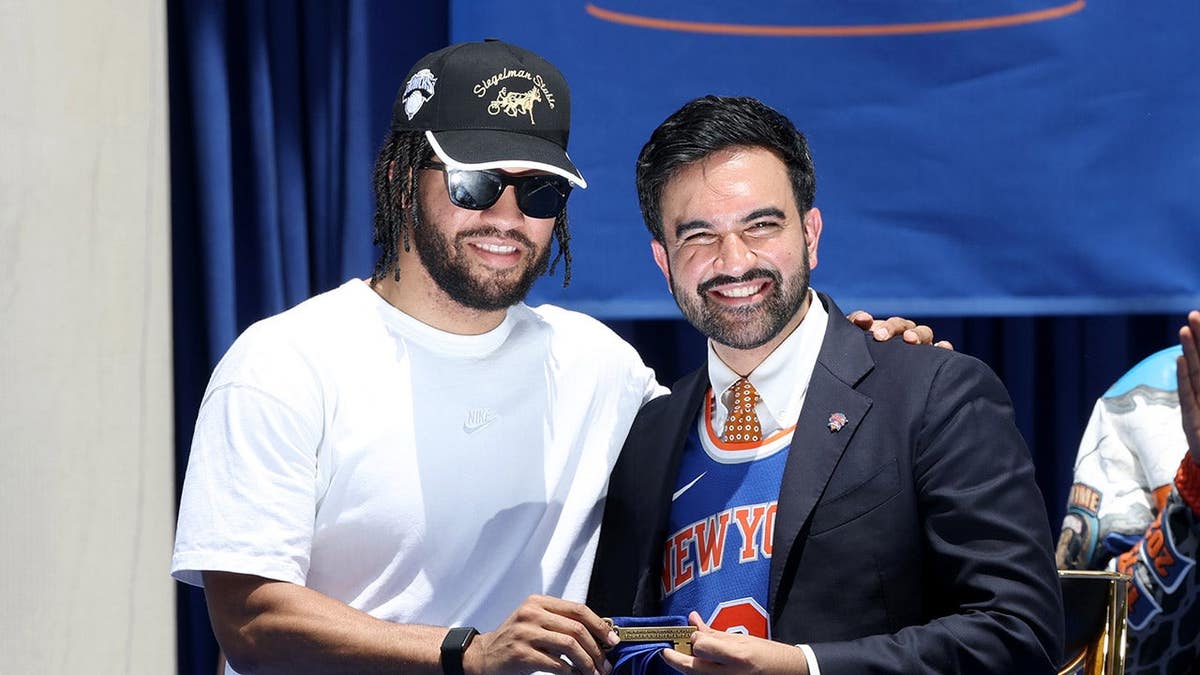 New York City Mayor Zohran Mamdani handing keys to New York Knicks player Jalen Brunson during parade