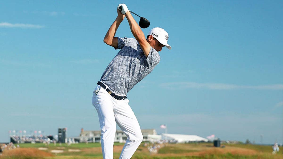 Joaquín Niemann playing a golf shot from the 18th tee at Shinnecock Hills Golf Club