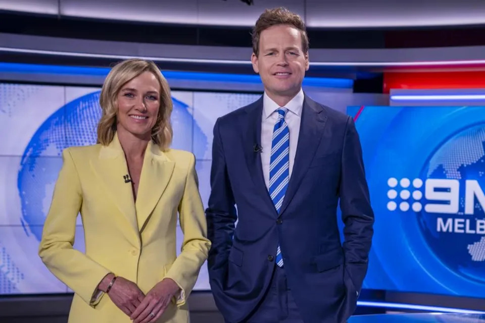 Man and woman at the Nine News studio in Melbourne