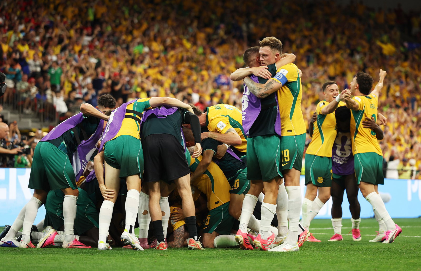 Harry Souttar (centre) was massive at the back as the Socceroos began their World Cup campaign with a 2-0 win.