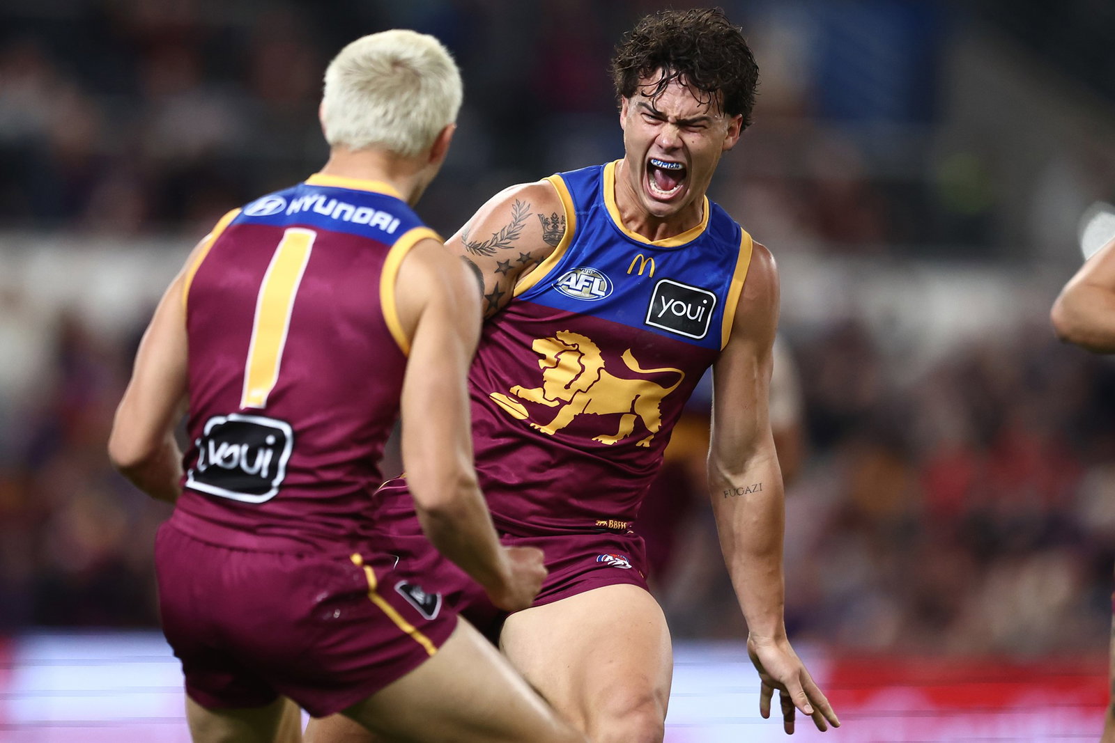 Cam Rayner of the Lions celebrates a goal during the round 16 AFL match between Brisbane Lions and Sydney Swans at The Gabba, on June 25, 2026, in Brisbane, Australia.