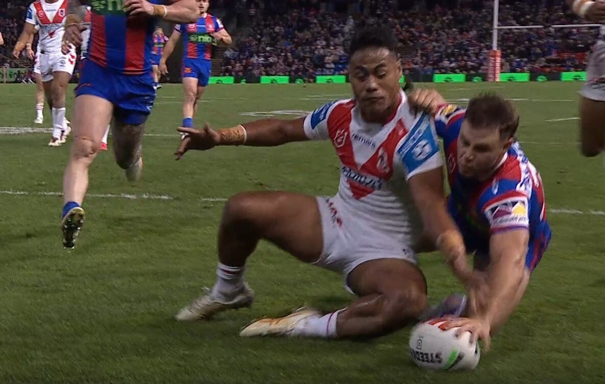 Sandon Smith scores for the Knights, ground the ball with one hand