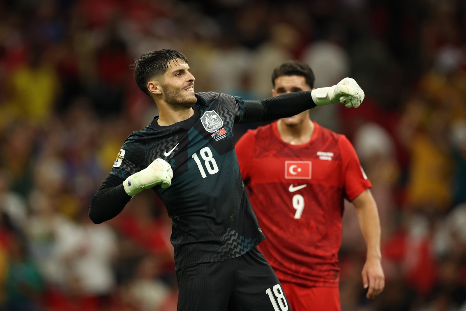 Patrick Beach celebrates after one of his eight saves against Turkiye.