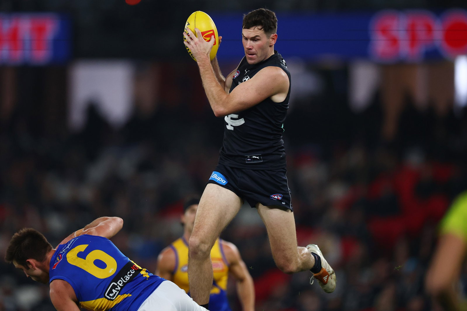  Mitch McGovern of the Blues marks the ball during the round 16 AFL match between Carlton Blues and West Coast Eagles at Docklands on June 27, 2026, in Melbourne, Australia.