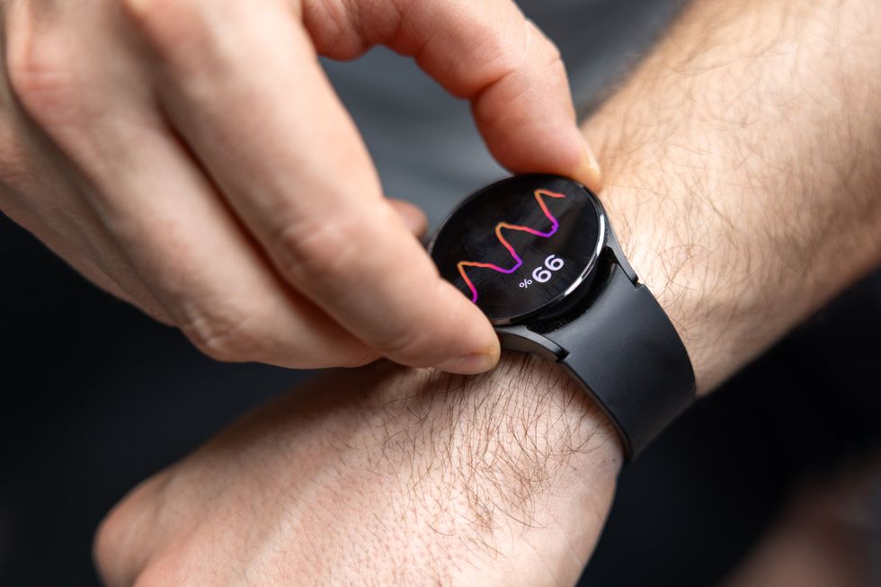 MAN CHECKING APPLE WATCH