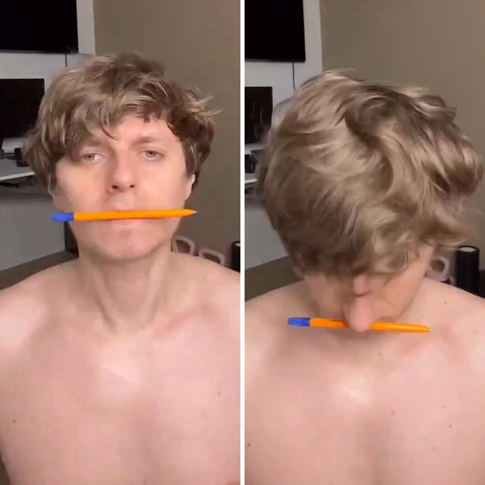 Man performing daily jaw exercises with pen between lips for transformation Man performing daily jaw exercises with pen between lips for transformation
