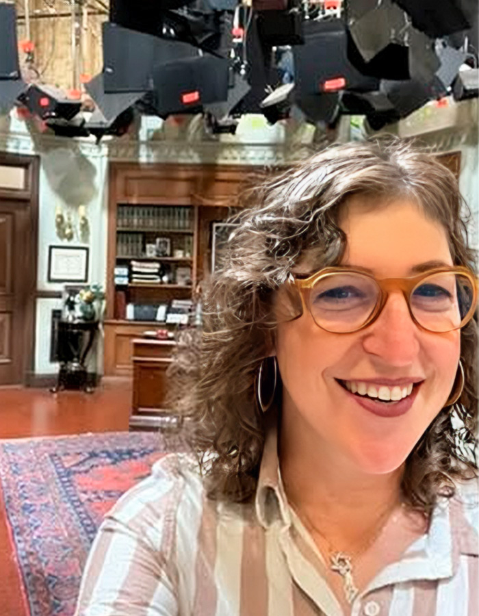 Mayim Bialik smiling on set discussing GLP-1 side effects Mayim Bialik smiling on set discussing GLP-1 side effects