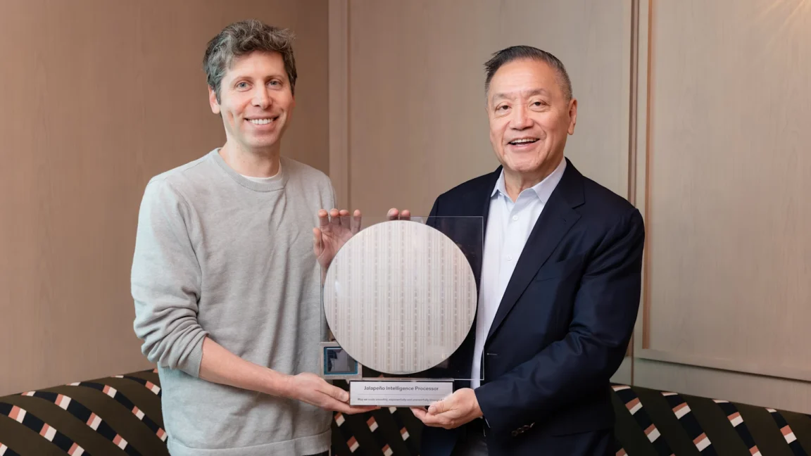 Two men hold a trophy-like chip display.
