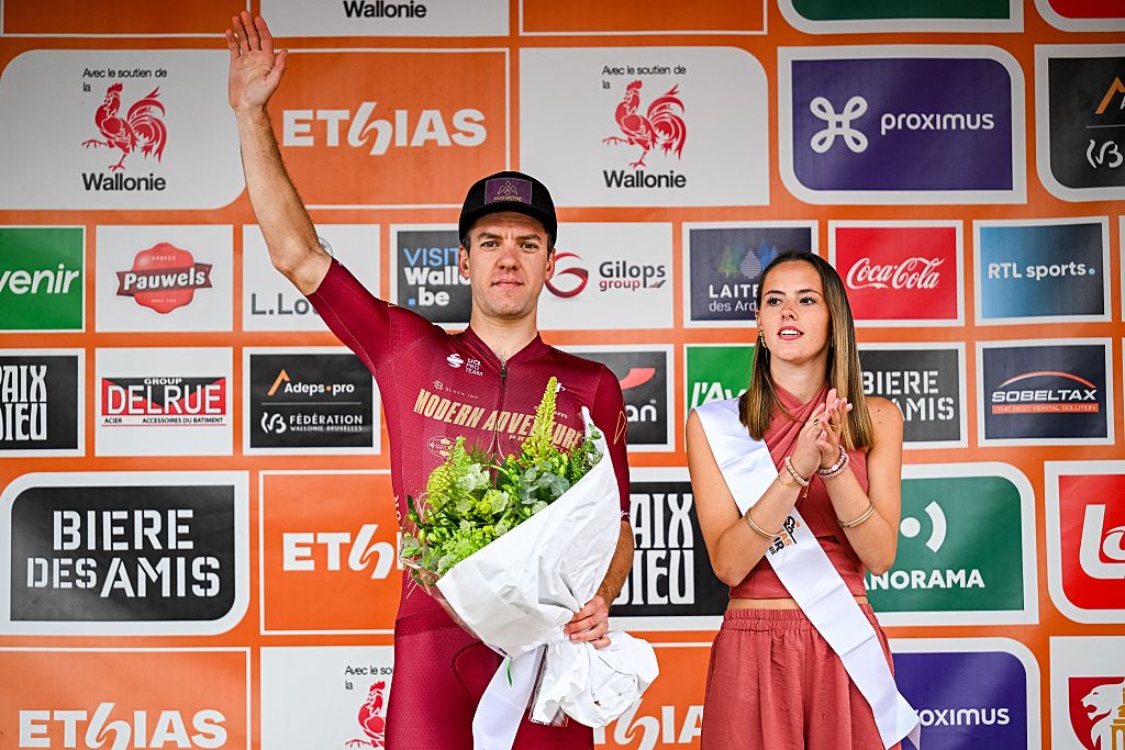 New Zealander Ben Oliver of Modern Adventure Pro Cycling celebrates on the podium after winning the fifth stage of the Tour De Wallonie cycling race, from Bassenge to Aubel (176,4 km), on Friday 05 June 2026. BELGA PHOTO DAVID PINTENS (Photo by DAVID PINTENS / BELGA MAG / Belga via AFP)