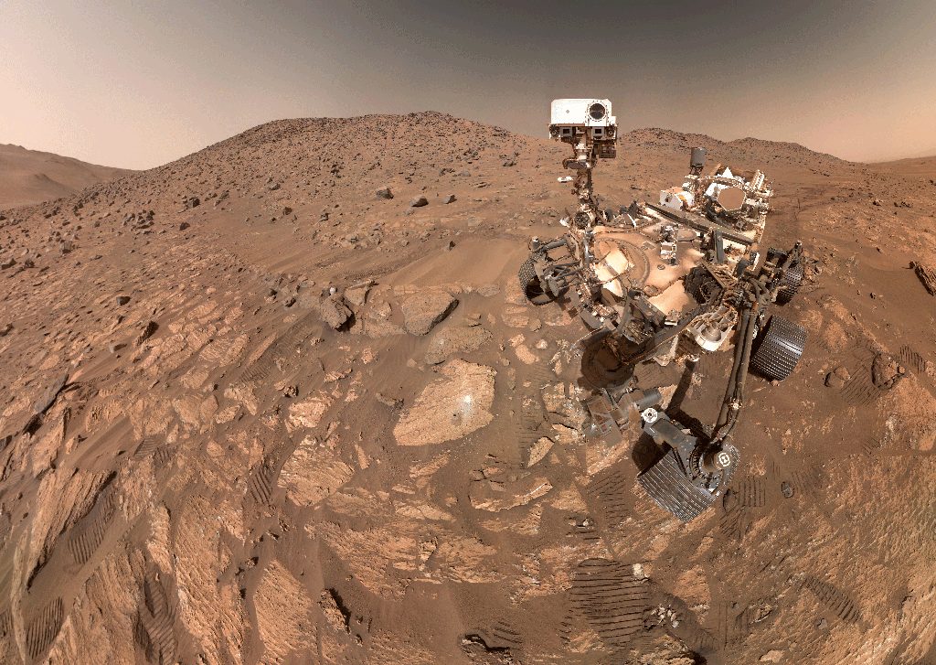 In a selfie taken on Mars, NASA's Perseverance rover--a six-wheeled robot with a camera that moves in this animated image--is seen against the landscape of the Red Planet.