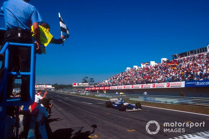 Coulthard crosses the line to win his maiden F1 grand prix at the 1995 Portuguese GP