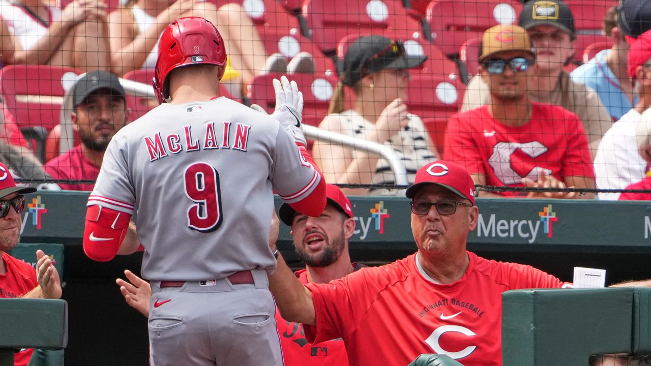 Cincinnati Reds' Matt McLain (9) is congratulated by manager Terry Francona, right, after hitting a solo home run during the seventh inning of a baseball game against St. Louis Cardinals Sunday, June 7, 2026, in St. Louis. (AP Photo/Jeff Roberson)