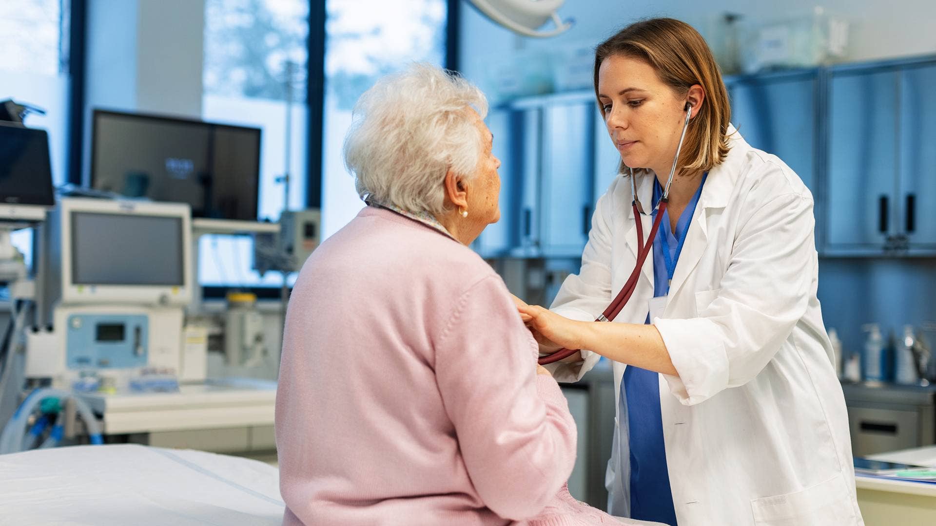 Retired woman getting checked by a female doctor