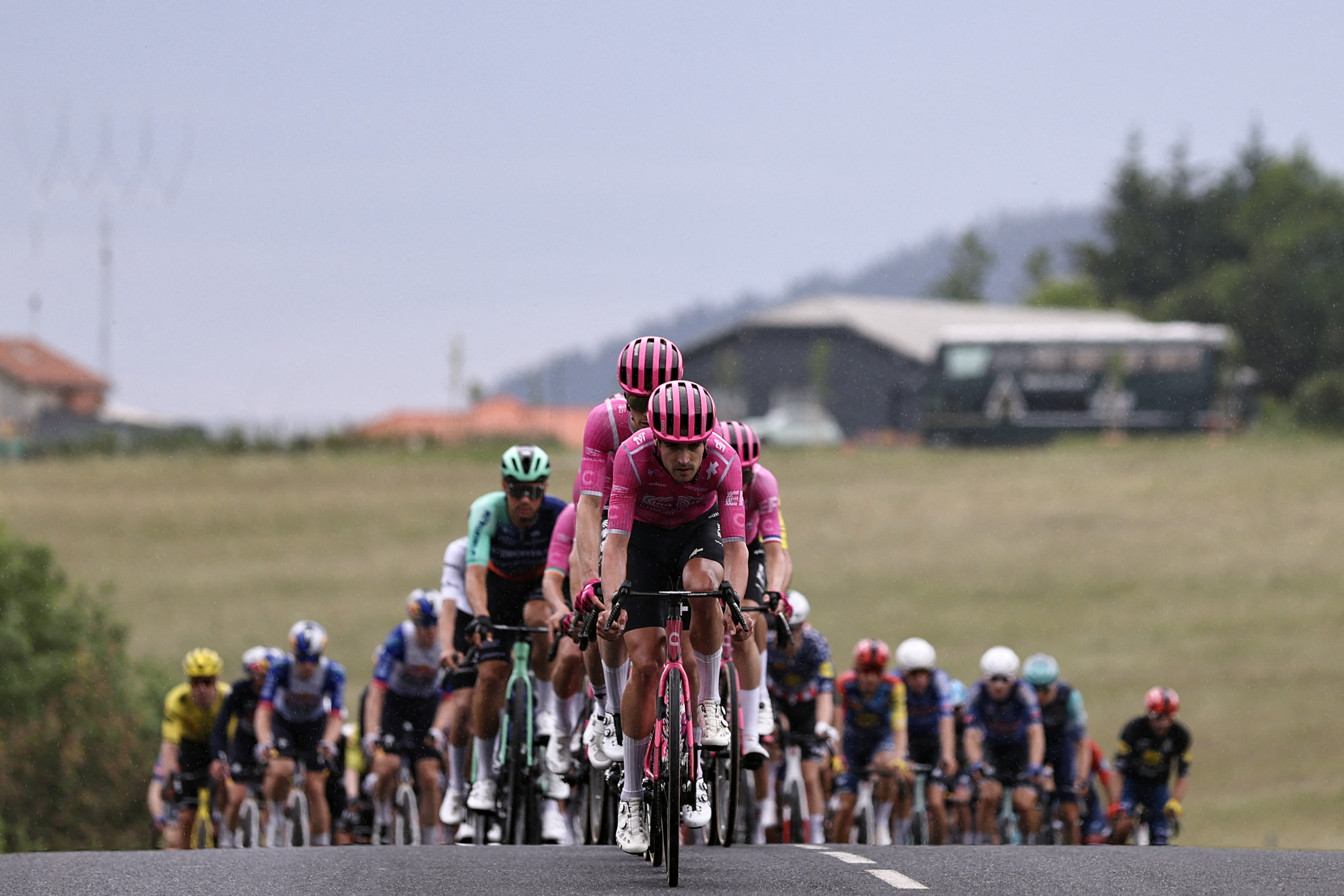EF Education - EasyPost's British rider Max Walker leads the pack of riders (peloton) during the 2nd stage of the Tour Auvergne-Rhone-Alpes cycling race (formerly known as the Criterium du Dauphine), 234,3km between Saint-Martin-Le-Vinoux in the French Alps and Le Puy-en-Velay near the Massif Central, on June 8, 2026. (Photo by Anne-Christine POUJOULAT / AFP)