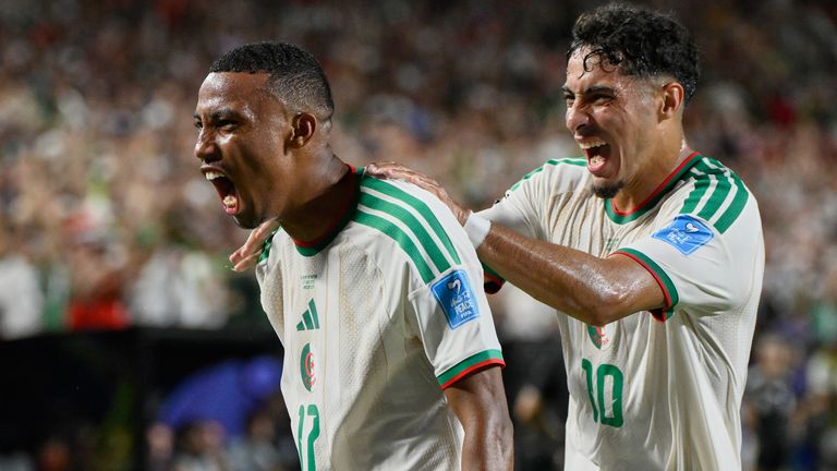 Algeria's Rafik Belghali celebrates scoring against Austria