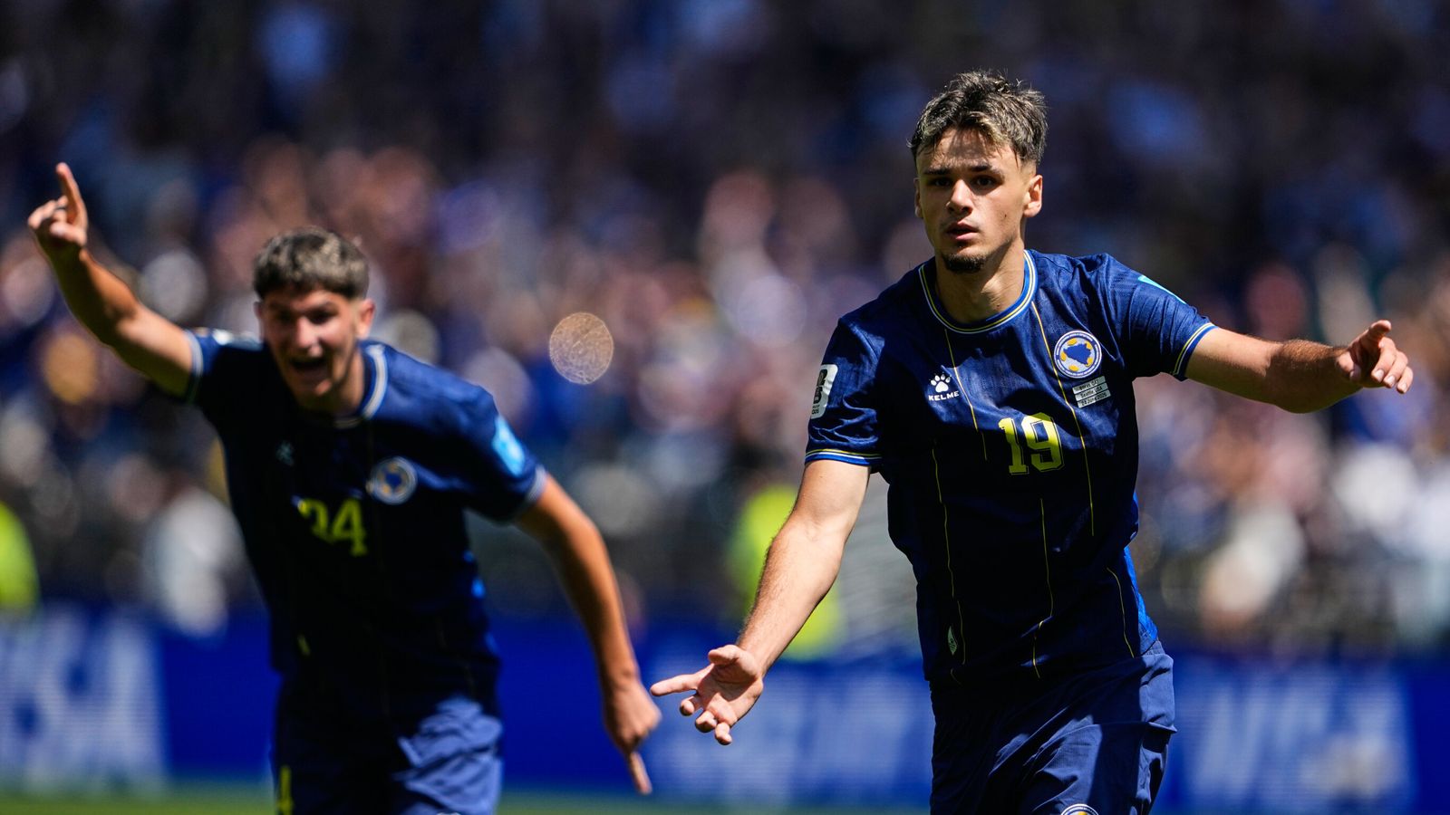 Bosnia's Kerim Alajbegovic, right, celebrates after scoring his side's opening goal during the World Cup Group B soccer match against Qatar in Seattle, Wednesday, June 24, 2026. (AP Photo/Lindsey Wasson)