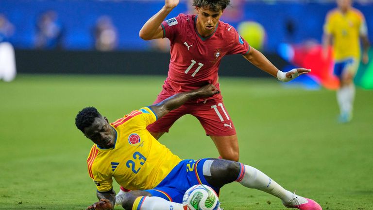 Portugal's Joao Felix (11) and Colombia's Davinson Sanchez (23) battle for the ball
