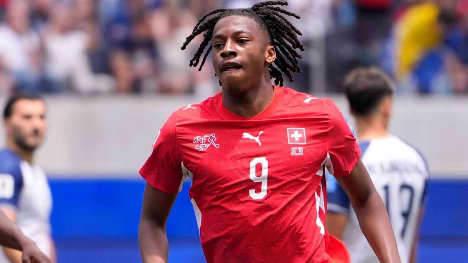 Switzerland's Johan Manzambi celebrates after scoring the opening goal against Bosnia and Herzegovina
