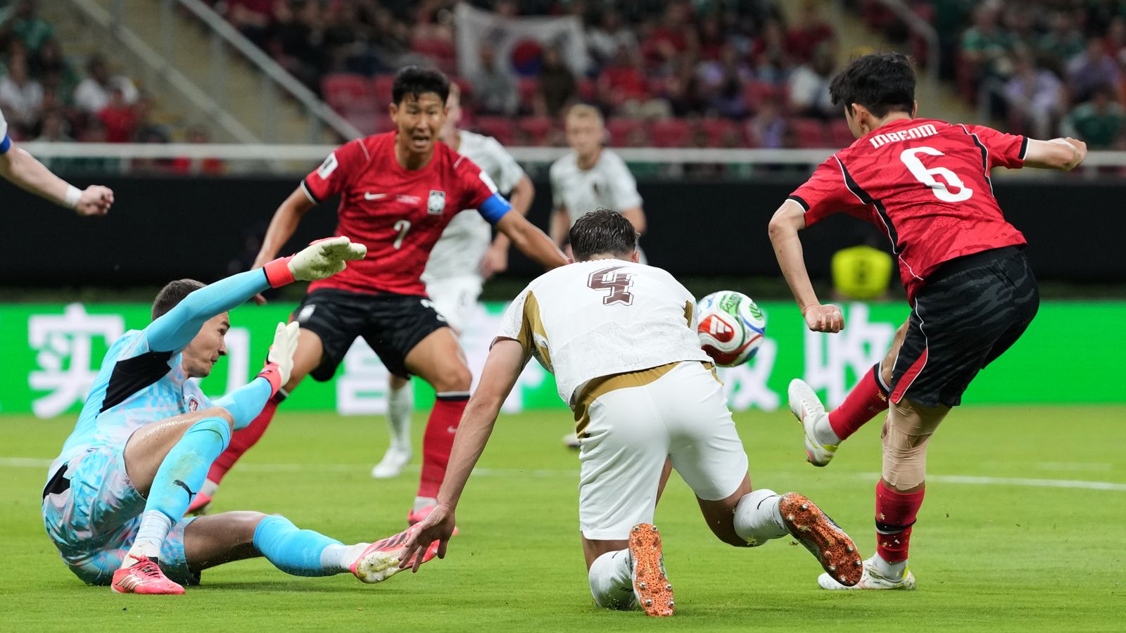 South Korea's Hwang In-Beom, right, scores his team's first goal of the World Cup against Czech Republic