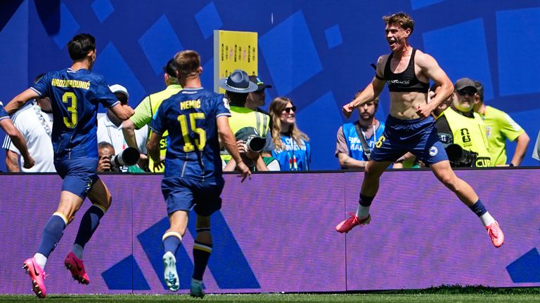 Bosnia's Ermin Mahmic, right, jumps as he celebrates with teammates after scoring his side's third goal during the World Cup Group B soccer match against Qatar in Seattle, Wednesday, June 24, 2026. (AP Photo/Lindsey Wasson)