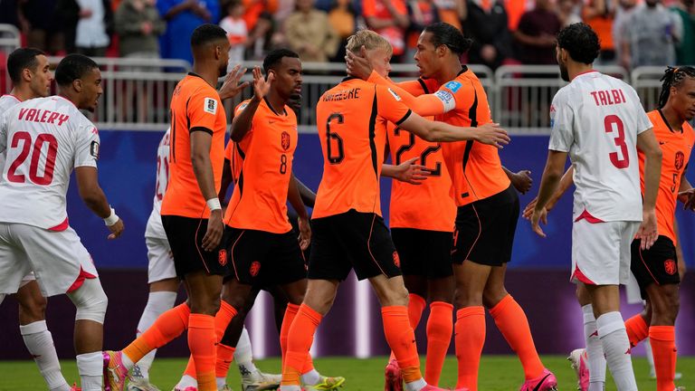 Netherlands players celebrate Tunisia's own goal during the World Cup Group F soccer match between Tunisia and the Netherlands in Kansas City, Mo., Thursday, June 25, 2026. (AP Photo/Charlie Riedel)