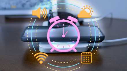 Phone wireless charging with alarm icons.
