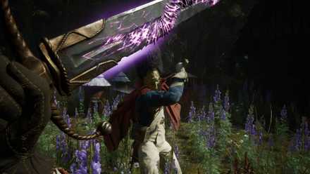 The player in Valor Mortis wielding a glowing purple sword with an enemy about to strike.