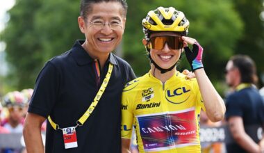 Zwift CEO, Eric Min and Katarzyna Niewiadoma who is wearing the Tour de France yellow jersey
