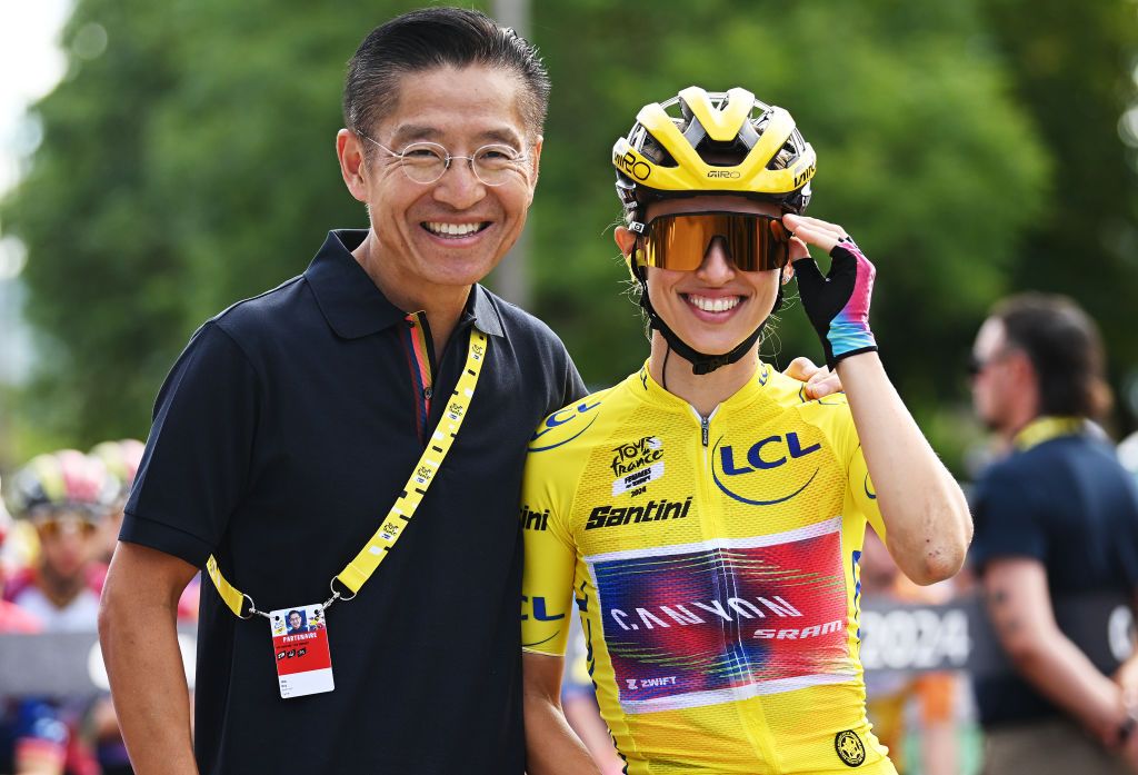 Zwift CEO, Eric Min and Katarzyna Niewiadoma who is wearing the Tour de France yellow jersey