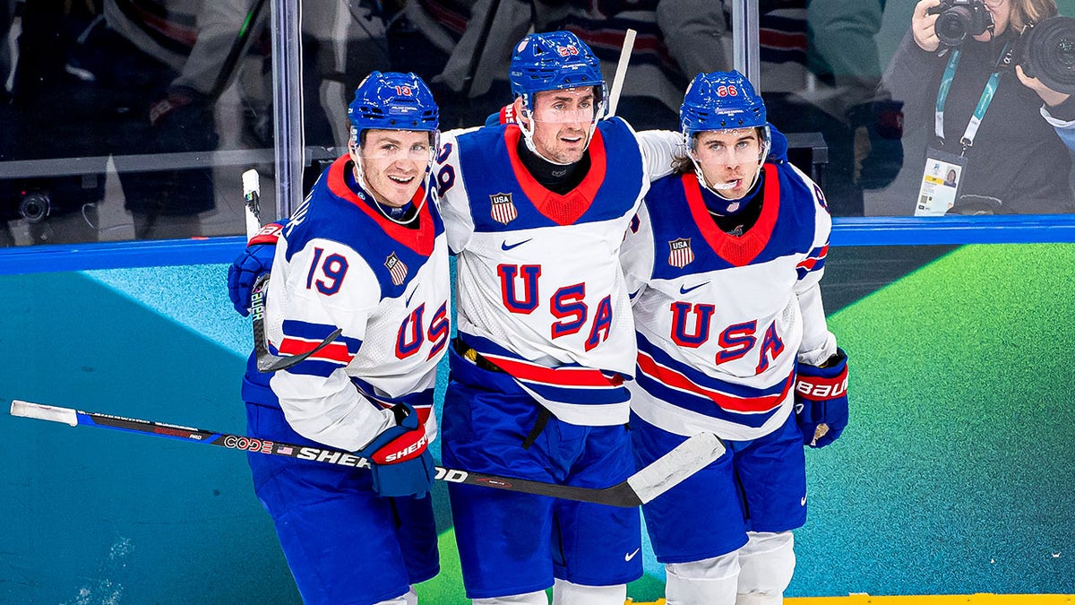 Brock Nelson celebrating goal with Matthew Tkachuk and Jack Hughes during ice hockey game