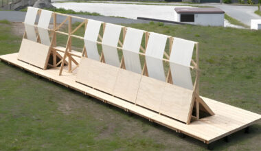 diagonal timber wall becomes furniture, shelter, and landscape frame in spain
