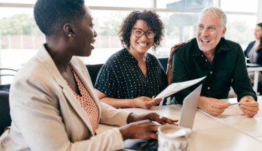 A couple discusses their finances with a financial planner.