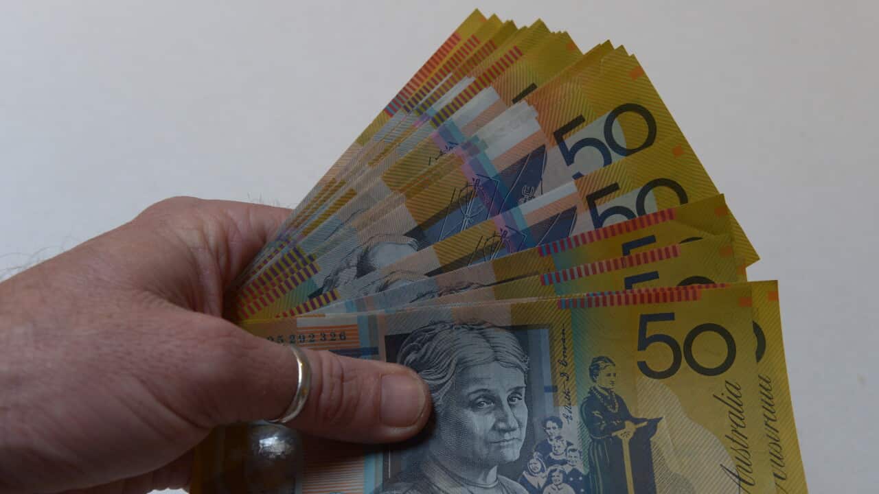 A wad of Australian fifty dollar notes