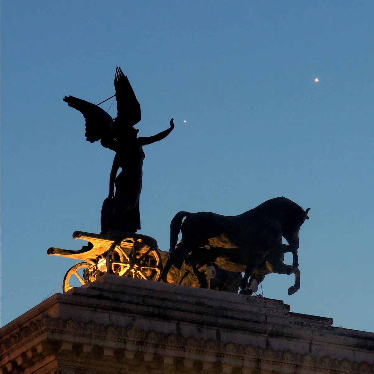 Paolo Palma captured this image of the Venus–Jupiter conjunction against the backdrop of the Quadriga of Unity at the Altar of the Fatherland in Rome, Italy, 9 June 2026. Equipment: Nikon coolpix p510 