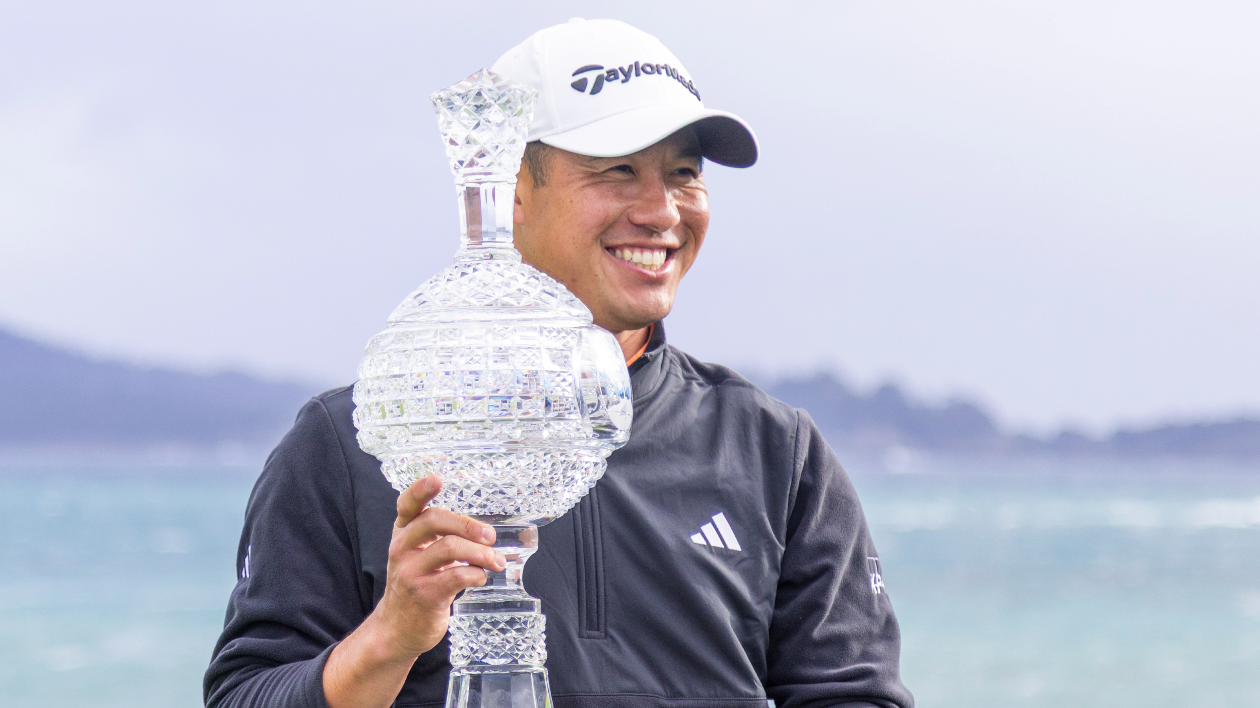 Collin Morikawa with the AT&amp;T Pebble Beach Pro-Am trophy