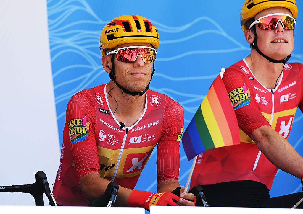 BEAUFORT, FRANCE - JUNE 14: Tobias Halland Johannessen of Norway and Team Uno-X Mobility riders displays an LGBT+ flag prior to the 78th Tour Auvergne-Rhone-Alpes 2026, Stage 8 a 120.1km stage from Beaufort to Plateau de Solaison - Brison 1497m / #UCIWT / on June 14, 2026 in Beaufort, France. (Photo by Dario Belingheri/Getty Images)