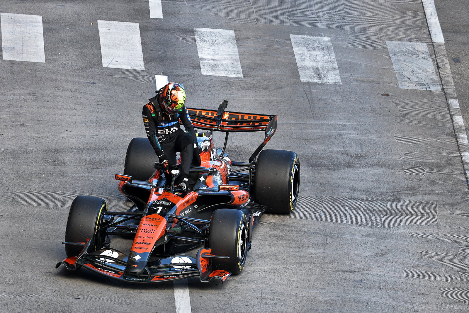 Norris climbs out of his stricken McLaren 