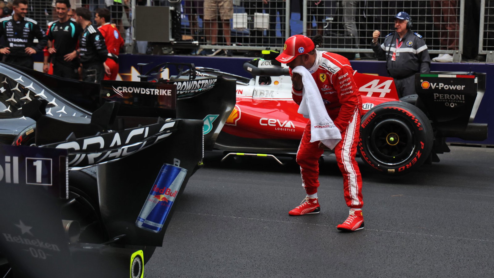 Hamilton inspects the Mercedes after the Monaco Grand Prix